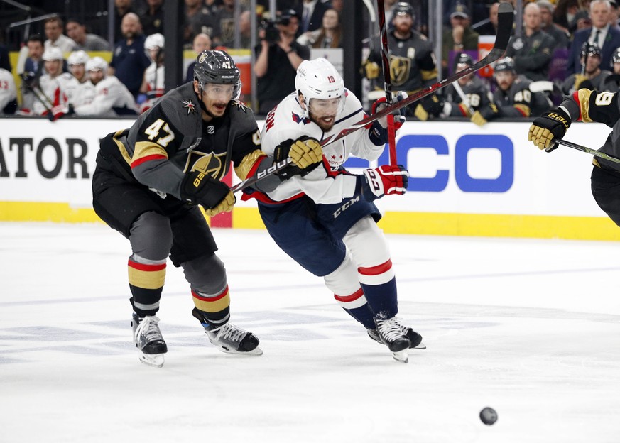 Vegas Golden Knights defenseman Luca Sbisa, of Italy, and Washington Capitals center Chandler Stephenson skate to the puck during the first period in Game 2 of the NHL hockey Stanley Cup Finals on Wed ...