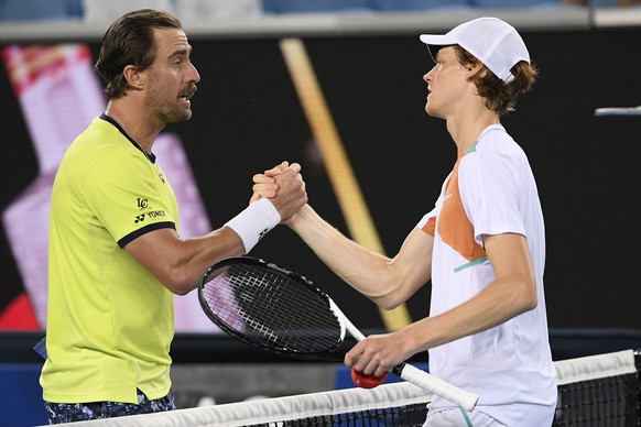 Jannik Sinner, right, of Italy is congratulated by Steve Johnson of the U.S. after winning their second round match at the Australian Open tennis championships in Melbourne, Australia, Thursday, Jan.  ...