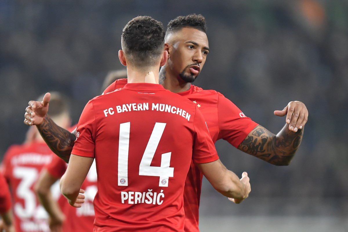 Bayern's Ivan Perisic, left,, celebrates with Bayern's Jerome Boateng after scoring his side's first goal during the German Bundesliga soccer match between Borussia Moenchengladbach and ...