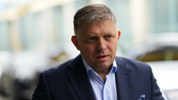 FILE - Chairman of SMER-Social Democracy party Robert Fico arrives at his party&#039;s headquarters in Bratislava, Slovakia, Sunday, Oct. 1, 2023 the day after an early parliamentary election. Media r ...