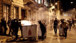 epa04122453 Protestors try to build a barricade as they clash with riot police during a demonstration for Berkin Elvan, in Istanbul, Turkey, 12 March 2014. Police used water cannon and tear gas Wednesday to clear protesters in central Istanbul, where more than 15,000 people had gathered for the funeral of the 15-year old boy who died this week from injuries sustained during anti-government protests on Taksim Square last year.  EPA/SEDAT SUNA