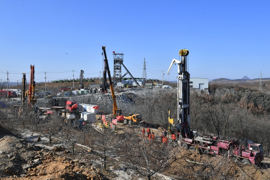 epa08947608 Rescuers work in the aftermath of an explosion at a gold mine site in Qixia city, Shandong province, China, 18 January 2021 (issued 19 January 2021). Around 22 workers have been trapped un ...