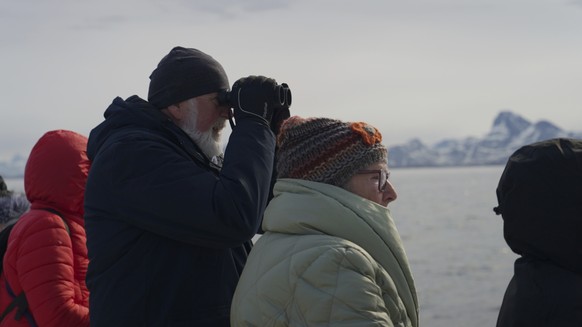 Tourists on a whale watching boat tour look for a whale at sea near Nuuk, Greenland, Tuesday, June 17, 2025. (AP Photo/Kwiyeon Ha)
EU-Greenland-Tourism