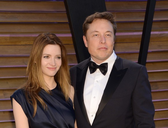 FILE - In this March 2, 2014 file photo, Talulah Riley, left, and Elon Musk attend the 2014 Vanity Fair Oscar Party, in West Hollywood, Calif. Musk and his wife are divorcing for a second time. The en ...