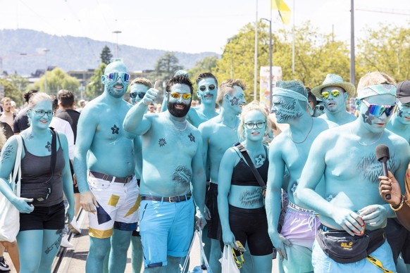 Participants are dancing through the streets during the 30th Street Parade in the city center of Zurich, Switzerland, Saturday, August 12, 2023. The annual dance music event Street Parade runs this ye ...