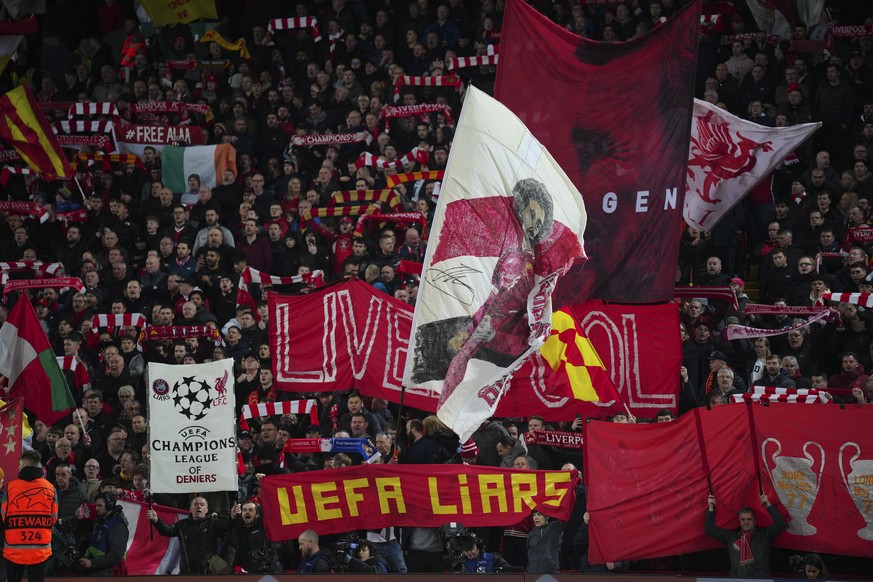 Liverpool fans cheer ahead of the Champions League, round of 16, first leg soccer match between Liverpool and Real Madrid at the Anfield stadium in Liverpool, England, Tuesday, Feb. 21, 2023. (AP Phot ...