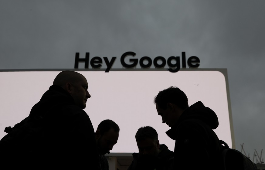 People stand in front of the Google tent during preparations for CES International, Saturday, Jan. 5, 2019, in Las Vegas. (AP Photo/John Locher)