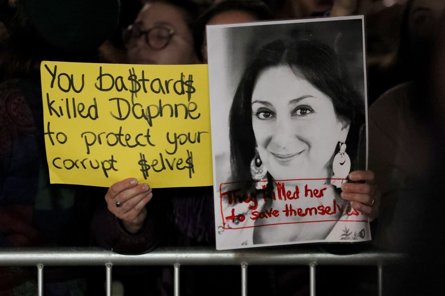 epa08027560 Demonstrators protest outside Malta&#039;s House of Parliament in Valletta, Malta, 26 November 2019 following the resignations of Minister Konrad Mizzi and Prime Minister Joseph Muscat&#03 ...