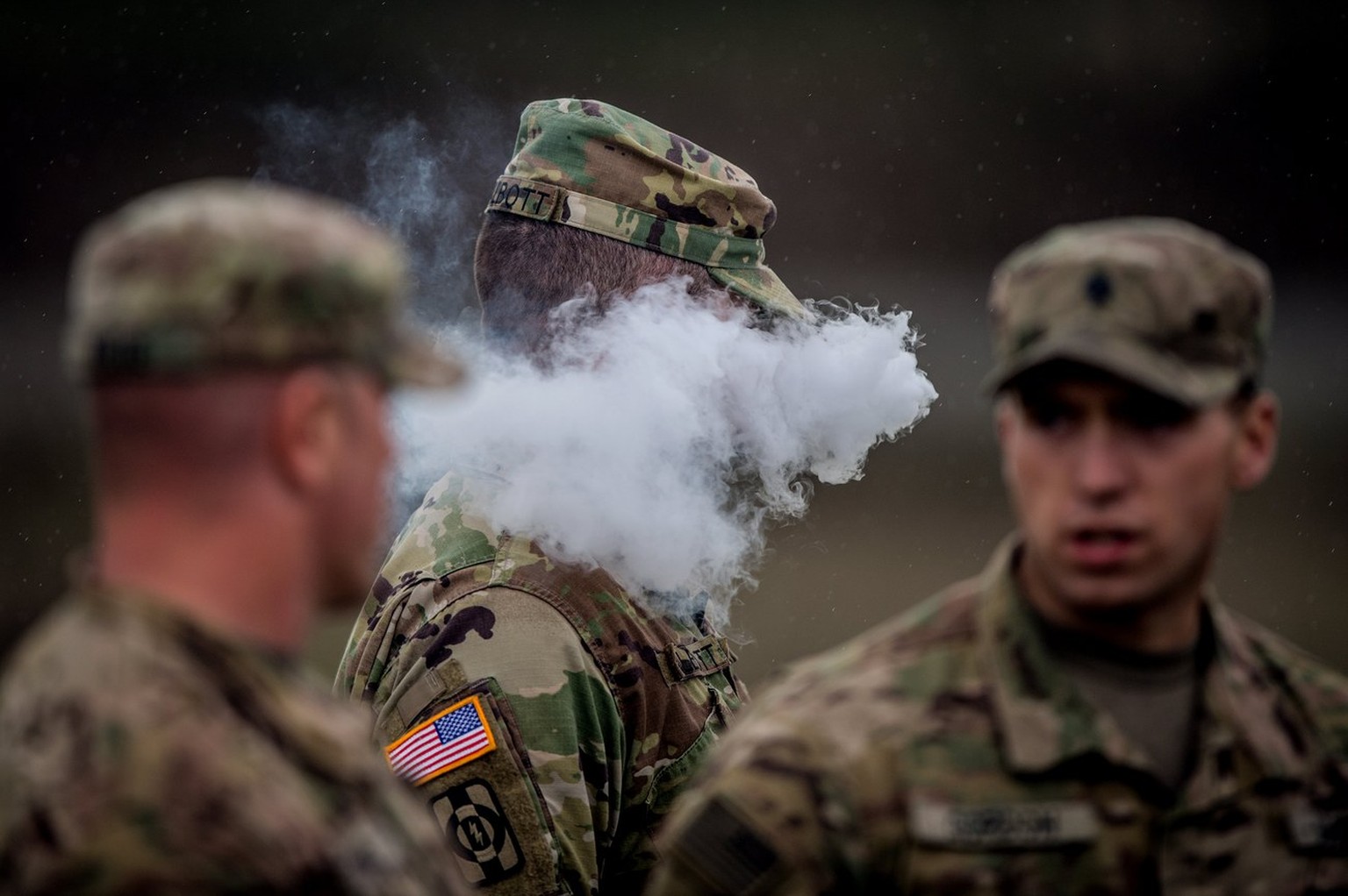 epa05959830 A US soldier smokes his e-cigarette during the Strong Europe Tank Challenge 2017 at the military training area in Grafenwoehr, Germany, 12 May 2017. Six North Atlantic Treaty Organization  ...