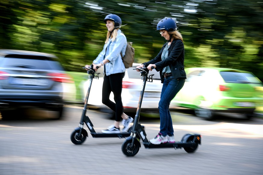 epa07627037 Women ride an CIRC e-scooter (former FLASH) in Herne, Germany, 05 June 2019. Even before electric pedal-scooters are allowed nationwide on 15 June, a first provider will start a rental ser ...