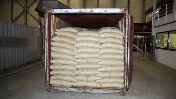 epa09930172 A handout photo made available by Fribourg cantonal police on 05 May 2022 shows a shipment containing cocaine seized in Romont, Switzerland, 02 May 2022 (Issued on 06 May 2022). An unknown ...
