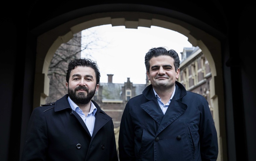 epa05811025 Tunahan Kuzu (R) and Selcuk Ozturk (L) of Dutch DENK Party pose at the Binnenhof in The Hague, The Netherlands, 23 February 2017. DENK leader Tunahan Kuzu accused Dutch doctors of discrimi ...