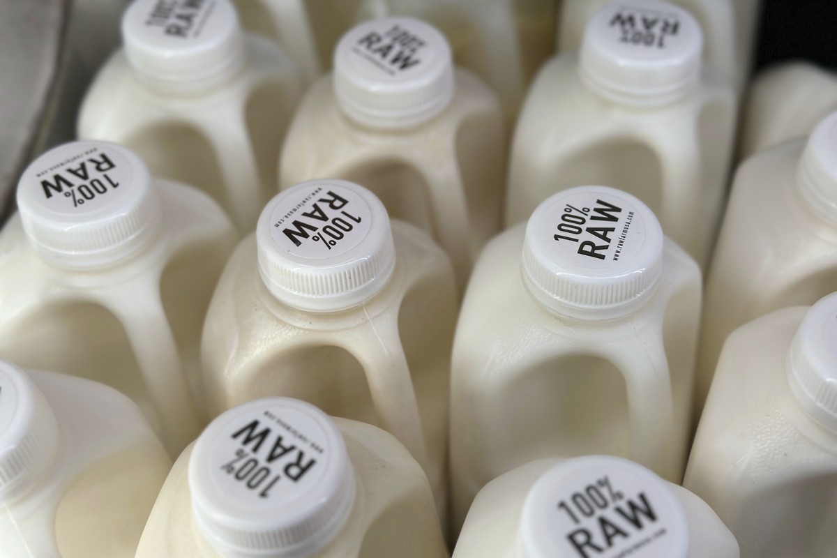 FILE - Bottles of raw milk from from Raw Farm of Fresno, Calif., are displayed for sale at a store in Temecula, Calif., on Wednesday, May 8, 2024. Dozens of salmonella illnesses have been linked to ra ...