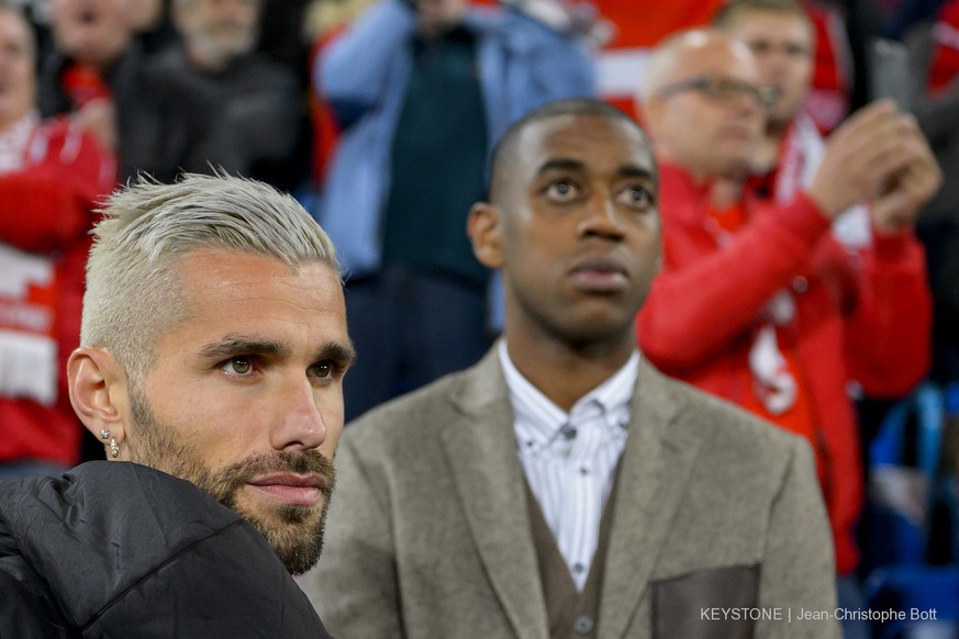 Switzerland&#039;s Valon Behrami, left, and Switzerland&#039;s, Gelson Fernandes, right, react during the 2018 Fifa World Cup Russia group B qualification soccer match between Switzerland and Hungary  ...