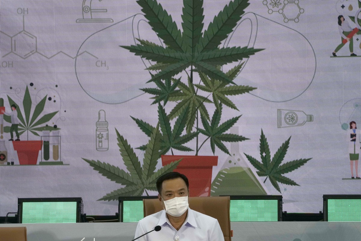 FILE - Thailand's Public Health Minister Anutin Charnvirakul speaks at a news conference at the Public Health Ministry in Nonthaburi, Thailand, Feb. 8, 2022, after signing a measure that drops ca ...
