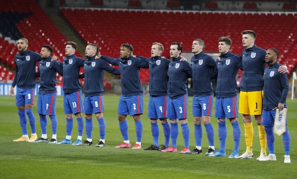 England players sing their national anthem ahead of the World Cup 2022 group I qualifying soccer match between England and San Marino at Wembley stadium in London, Thursday March 25, 2021. (Frank Augs ...