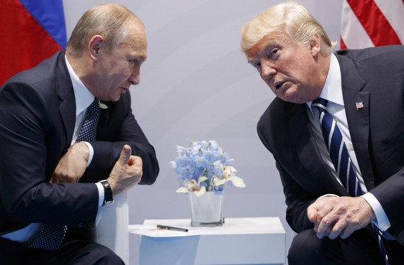 FILE - President Donald Trump meets with Russian President Vladimir Putin at the G-20 Summit in Hamburg, July 7, 2017. A Pew survey of democracies around the world finds that views of the U.S. as a mo ...