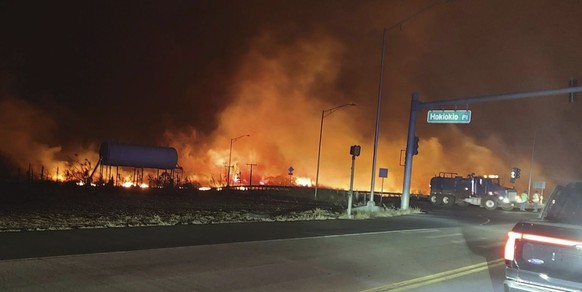 This photo provided by County of Maui shows fire and smoke filling the sky from wildfires on the intersection at Hokiokio Place and Lahaina Bypass in Maui, Hawaii on Tuesday, Aug. 8, 2023. Wildfires i ...