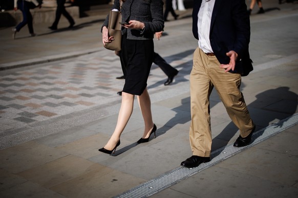 epa11612251 People walk in the financial district of the City of London, in London, Britain, 18 September 2024. International Equal Pay Day, observed on 18 September, highlights ongoing efforts to clo ...