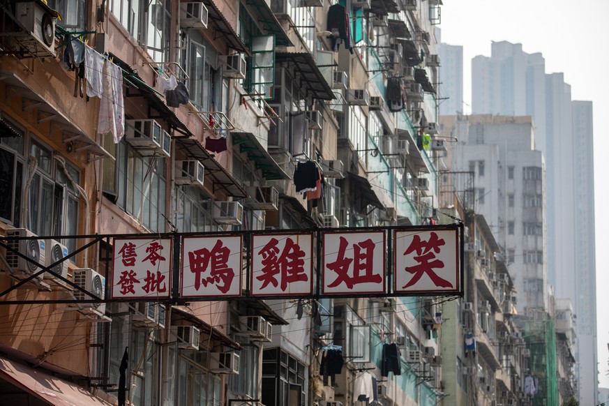 epa08956957 An old tenement building sits in Jordan district in Hong Kong, China, 22 January 2021. The Hong Kong government will place tens of thousands in lockdown in the districts of Jordan and Yau ...