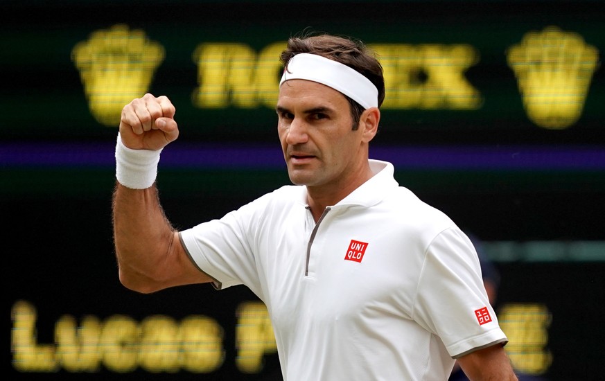 epa07699683 Roger Federer of Switzerland celebrates winning against Lucas Pouille of France in their third round match during the Wimbledon Championships at the All England Lawn Tennis Club, in London ...