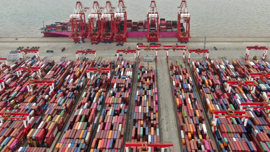 FILE - The Yangshan container port is seen in an aerial view in Shanghai, China on July 10, 2021. China?s exports tumbled in June, 2023, by 12.4% compared with a year earlier amid weaker global demand ...