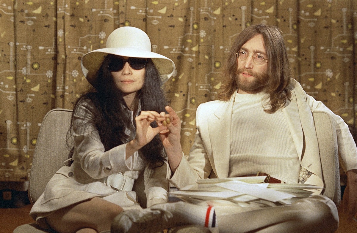 This 1969 photo shows musician John Lennon, right, and his wife Yoko Ono during a press conference. An album, "Gimme Some Truth" by John Lennon, will be released Friday, on what would have b ...