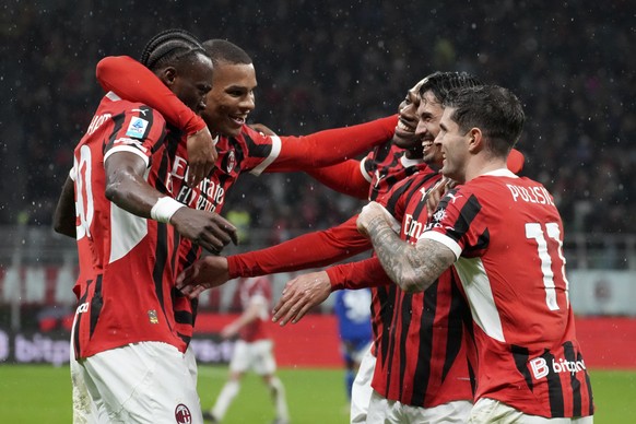 AC Milan&#039;s Tijjani Reijnders, second from right, wit teammates celebrates after scoring his side&#039;s second goal during the Italian Serie A soccer match between AC Milan and Como at the San Si ...