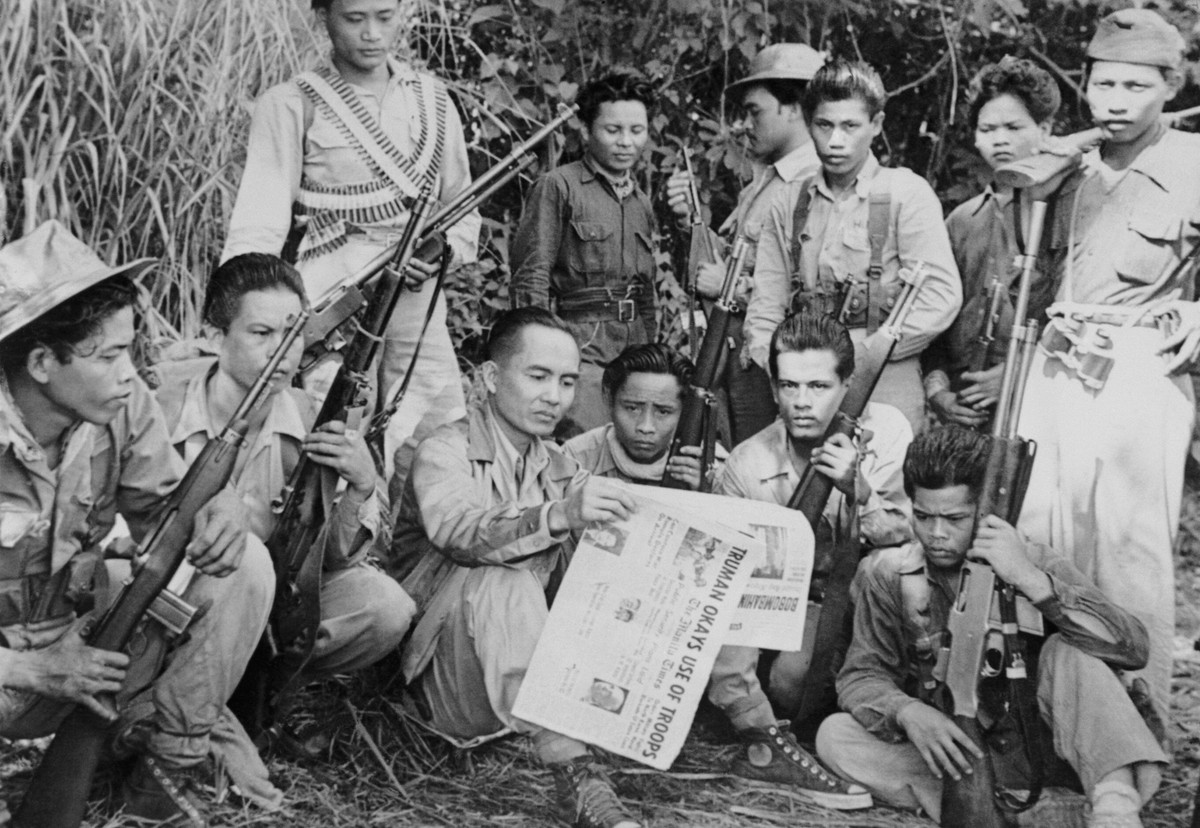 (Original Caption) Huk Chief Proves He's Alive. Luis M. Taruc, head man of the Huk Guerrillas in the Philippines, who has often been reported dead by Philippine government intelligence, proves it ...