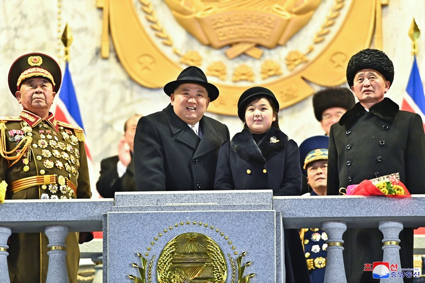 epaselect epa10455972 A photo released by the official North Korean Central News Agency (KCNA) shows North Korean Supreme leader Kim Jong-un (C-L) and his daughter Kim Jue-ae (C-R) viewing a military  ...