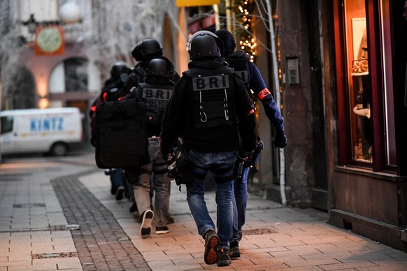 epa07225135 Members of the French National Police BRI (Research and Intervention Brigade) during their search for a suspect following a deadly shooting that took place at a Christmas market in Strasbo ...