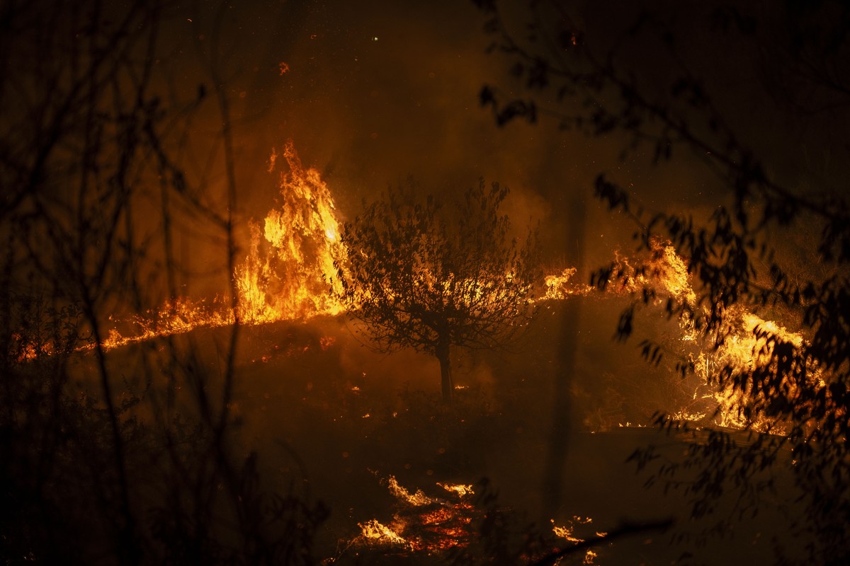 epa12303976 Flames and smoke rise from a forest fire in A Rua, Galicia, Spain, 16 August 2025. On 13 August, Spain activated the EU Civil Protection Mechanism for the first time ever due to multiple b ...