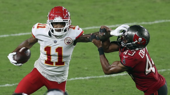 Kansas City Chiefs wide receiver Demarcus Robinson (11) stiff arms Tampa Bay Buccaneers defensive back Ross Cockrell (43) after a catch during the second half of an NFL football game Sunday, Nov. 29,  ...