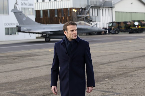 epa10417516 French President Emmanuel Macron reviews troops before his New Year address to the French Army at the Mont-de-Marsan air base, France 20 January 2023. President Emmanuel Macron is expected ...