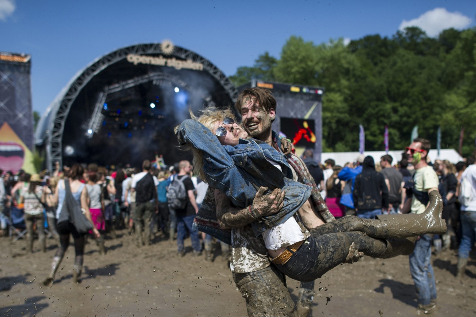 Festivalvisitors dancing in the mud during the OpenAir St. Gallen on Sunday, June 30, 2013, in St. Gallen. The OpenAir St.Gallen is one of the oldest outdoor festivals in Switzerland. It's close  ...