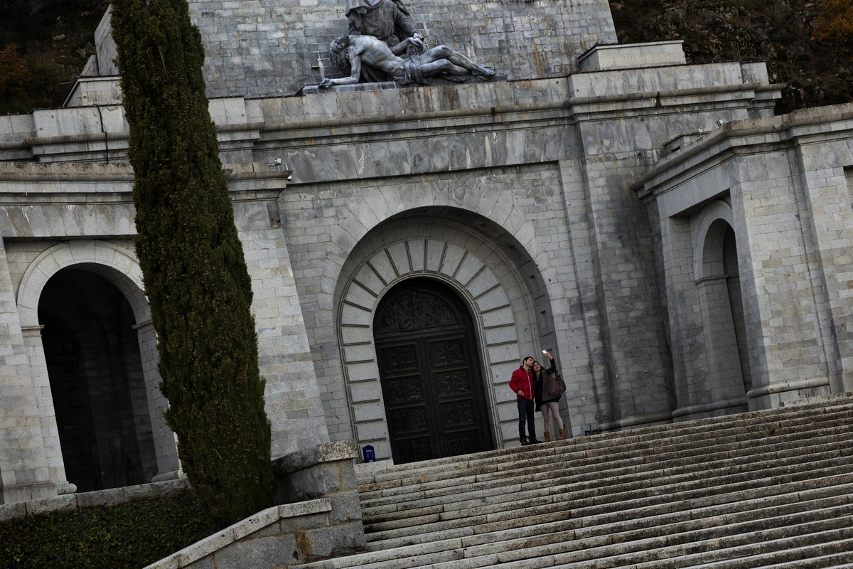 Tourists take a 'selfie' picture outside Spanish former dictator General Francisco Franco's tomb in his mausoleum in the Valle de los Caidos (Valley of the Fallen), near Madrid, Spain,  ...