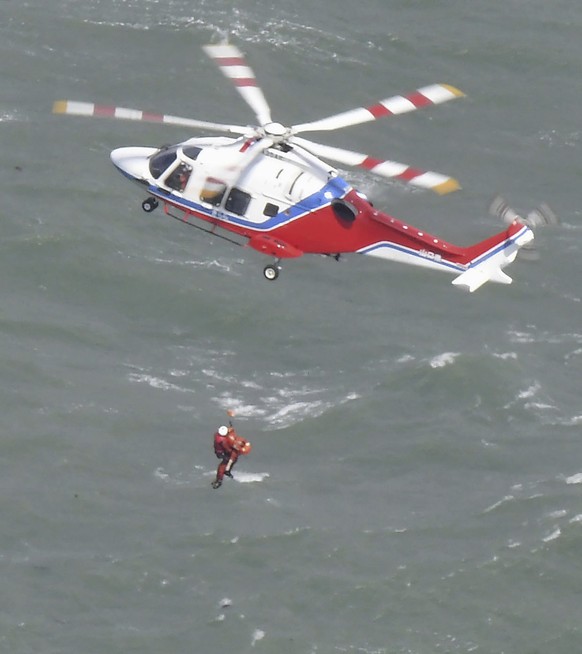 A rescue operation is conducted as a South Korean tanker capsized off Shimonoseki, Yamaguchi prefecture, southwestern Japan Wednesday, March 20, 2024. The coast guard said it received a distress call  ...