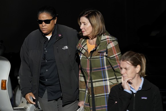 House Speaker Nancy Pelosi, middle, is escorted to a vehicle outside of her and husband Paul Pelosi&#039;s home in San Francisco, Wednesday, Nov. 2, 2022. (AP Photo/Jeff Chiu)
Nancy Pelosi