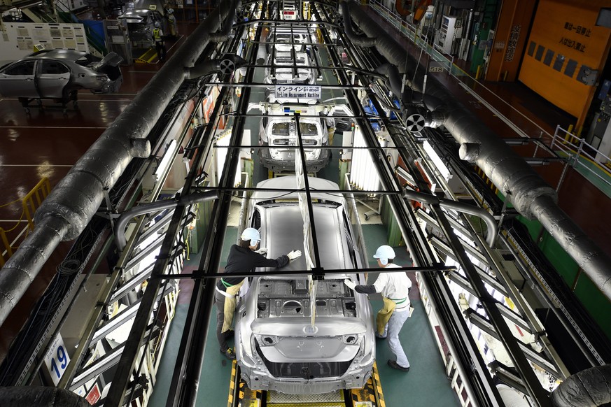 epa10826362 (FILE) - Workers check the surface of vehicles at the Toyota Tsutsumi car assembly plant in Toyota, near Nagoya, central Japan, 08 December 2017 (reissued 29 August 2023). Toyota Motor Cor ...