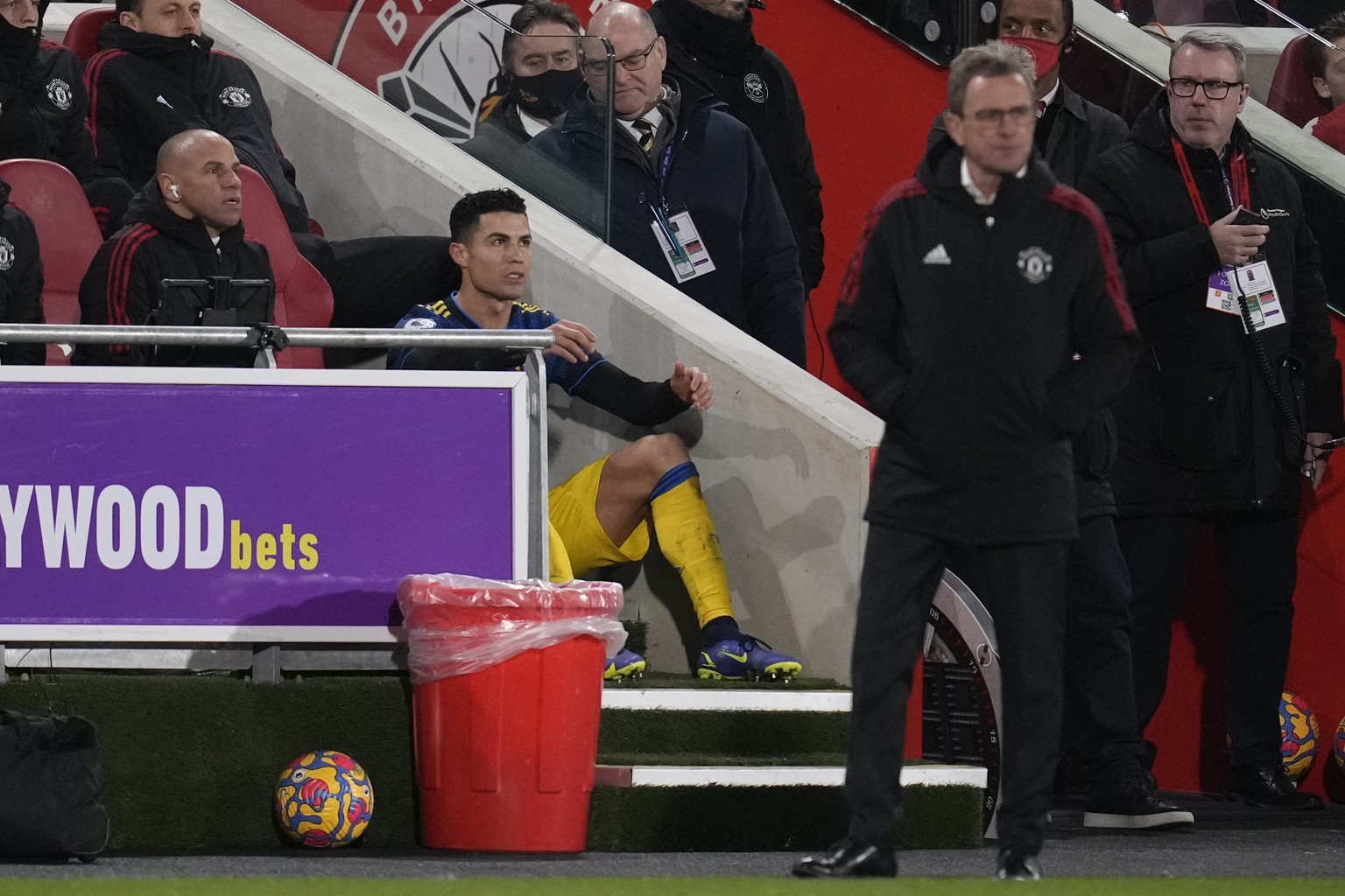 Manchester United&#039;s Cristiano Ronaldo sits watching the game after being substituted during an English Premier League soccer match between Brentford and Manchester United at the Brentford Communi ...