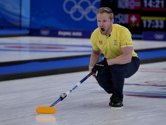 Sweden&#039;s Niklas Edin, directs his teammates, during the men&#039;s curling match against China, at the 2022 Winter Olympics, Wednesday, Feb. 9, 2022, in Beijing. (AP Photo/Nariman El-Mofty)