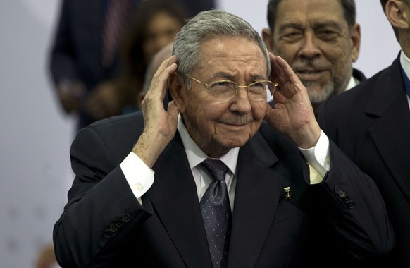 Cuba&#039;s President Raul Castro cups his ears to better hear a question shouted out at him during the official group photo of the VII Summit of the Americas, in Panama City, Panama, Saturday, April  ...