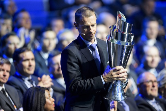 UEFA president Aleksander Ceferin holds the UEFA Nations League trophy during the soccer UEFA Nations League draw, at the SwissTech Convention Center, in Lausanne, Switzerland, Wednesday, January 24,  ...