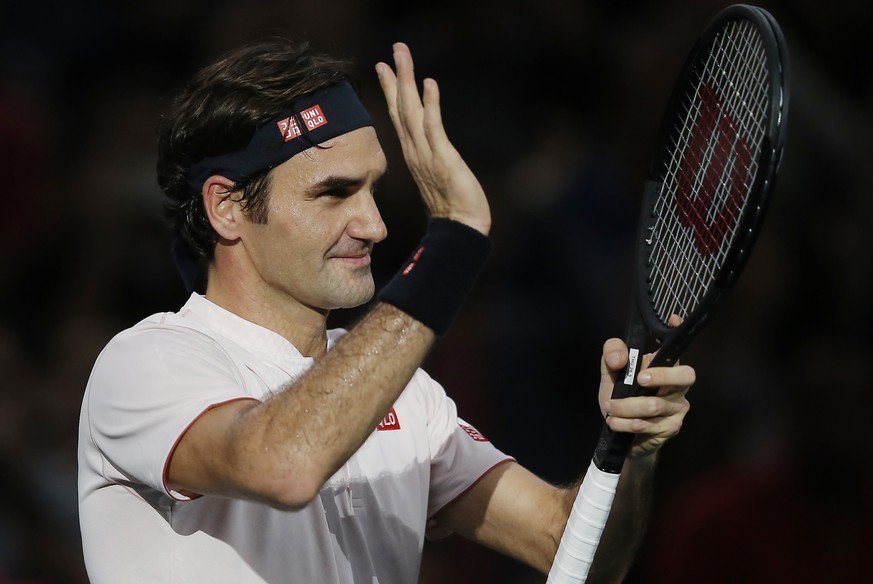 Roger Federer of Switzerland acknowledges applauses after defeating Fabio Fognini of Italy during their third round match of the Paris Masters tennis tournament at the Bercy Arena in Paris, France, Th ...