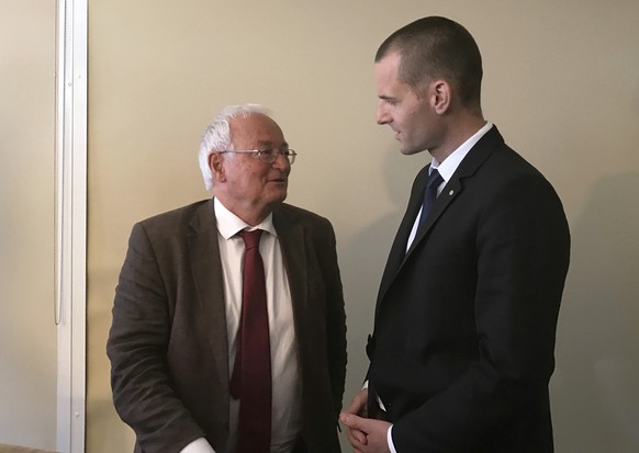 FILE - This is a Wednesday, May 10, 2017 file photo of German judge Hans-Joachim Eckert, left, and Swiss prosecutor Cornel Borbely as they speak after a FIFA ethics press conference in Manama, Bahrain ...