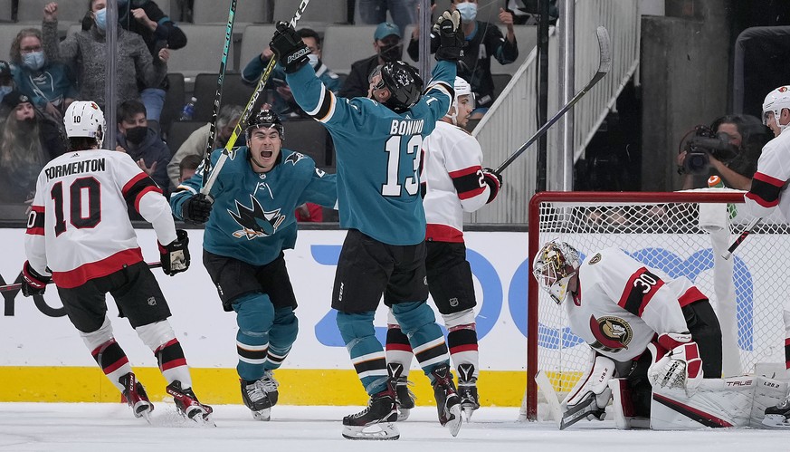 San Jose Sharks center Nick Bonino (13) celebrates with right wing Timo Meier, center, after scoring a goal past Ottawa Senators goaltender Matt Murray (30) during the second period of an NHL hockey g ...