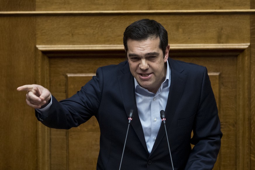 Greek Prime Minister Alexis Tsipras speaks at the parliament before the vote of new batch reforms, including measures that would make it harder for labor unions to call strikes, in Athens, on Monday,  ...