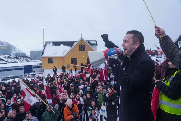 Greenlandic Prime Minister Jens-Frederik Nielsen speaks during a protest against Trump's policy towards Greenland in front of the US consulate in Nuuk, Greenland, Saturday, Jan. 17, 2026. (AP Pho ...
