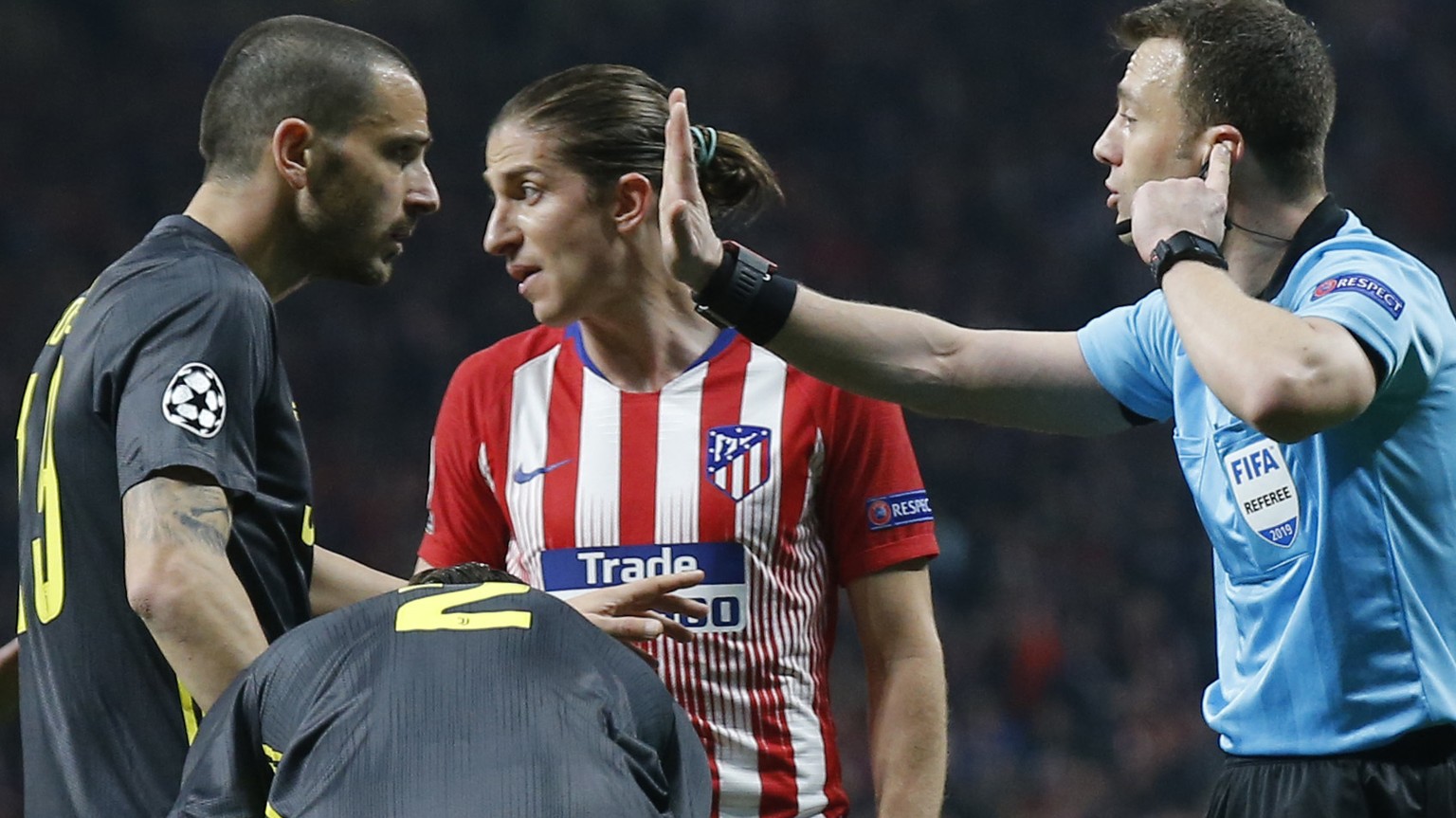 Referee Felix Zwayer speaks with Juventus defender Leonardo Bonucci during the Champions League round of 16 first leg soccer match between Atletico Madrid and Juventus at Wanda Metropolitano stadium i ...