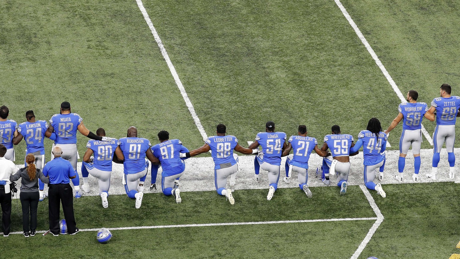 FILE - In this Sept. 24, 2017, file photo, Detroit Lions players take a knee during the national anthem before an NFL football game against the Atlanta Falcons in Detroit. President Donald Trump&#039; ...